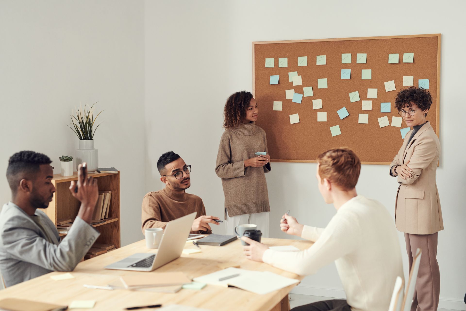 AudioDrive AI team collaborating during a production sync meeting